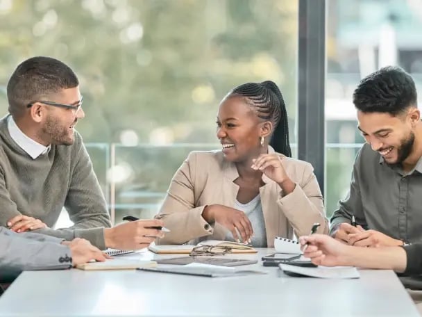 Team members talking and joking together