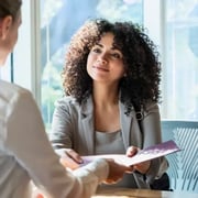 Team member being recognized by her manager for her accomplishments