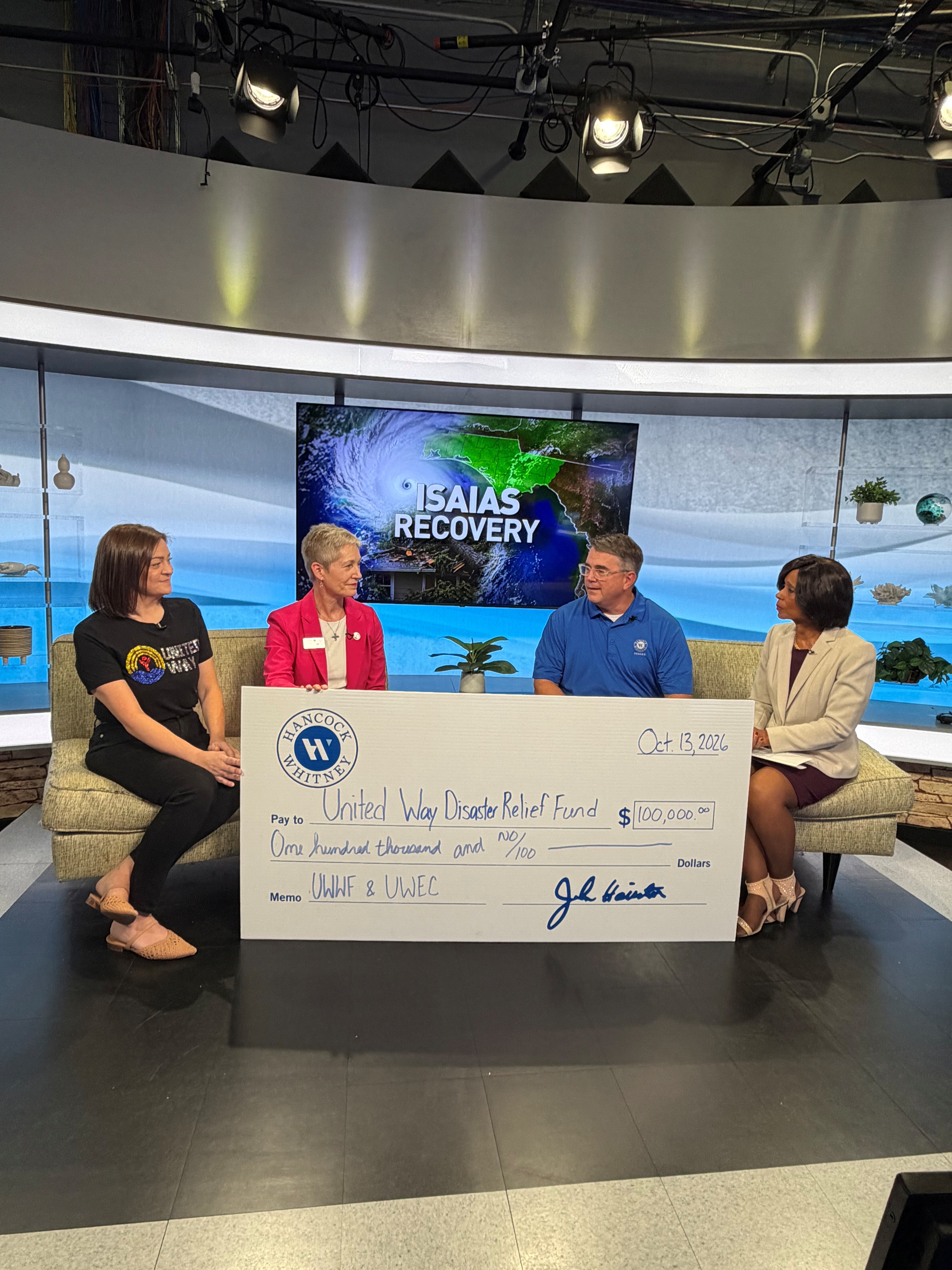 Check presentation on Channel 3 with Laura Gilliam, Kelly Jasen, Bruce Vredenburg and Reporter, Sue Straughn