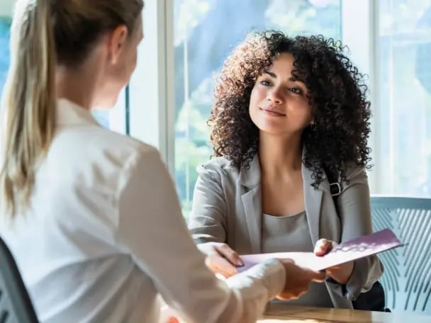 Businesswoman receiving an ABL proposal from her commercial banker