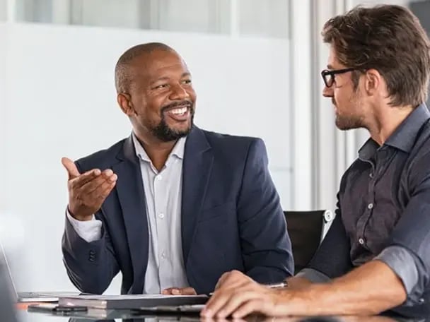 Businessmen discussing asset-based lending solutions