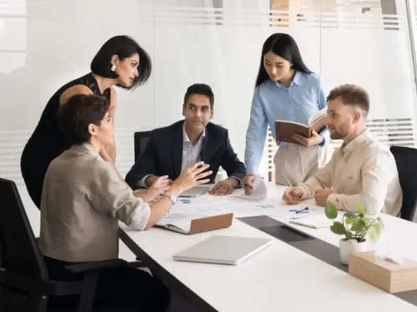 Corporate team reviewing securities underwriting agreement