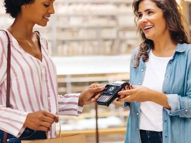 Entrepreneur using her business debit card to make a purchase