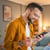 Man using his cell phone to open a new checking account