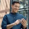 Man using his cellphone to review the Card Controls for his debit card