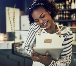 Business owner processing customer transaction over the phone