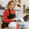 Employee using merchant services to complete a customer transaction