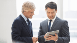 Business executives checking their treasury services