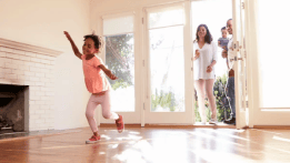 Family taking possession of their new home after getting approved for a mortgage