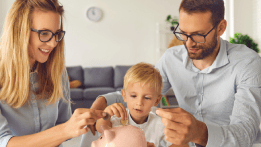 Parents teaching their child about money