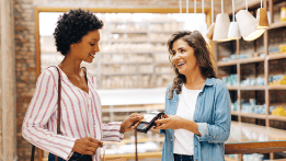 Woman using a credit card to make a purchase