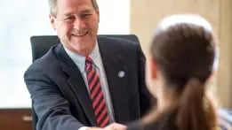 Commercial banker discussing a potential loan with a client