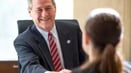 Commercial banker discussing a potential loan with a client
