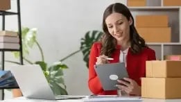 Business owner applying for an SBA loan on a tablet