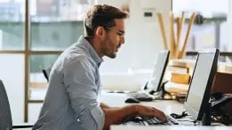 IT worker reviewing his company's cybersecurity