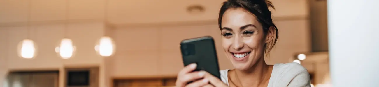 Woman setting up debit card controls on her smartphone