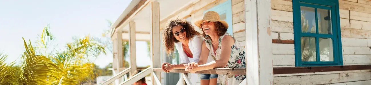 Two women on vacation discussing certificate of deposit options