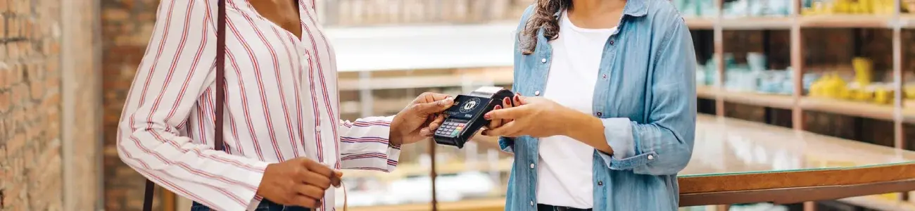 Business owner using debit card to pay for a transaction