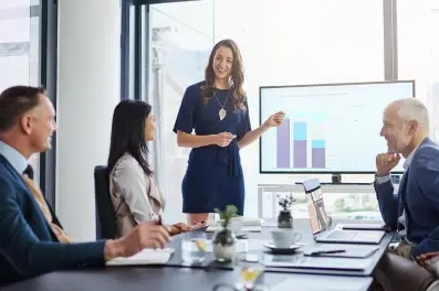 Businesswoman presenting on derivatives and interest rate risk management