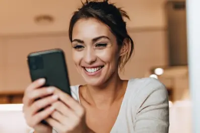 Woman setting up Card Controls on her smartphone
