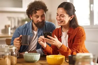 Couple reviewing their HELOC offer over breakfast.