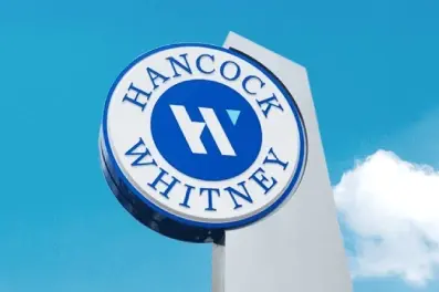 Hancock Whitney sign against the sky