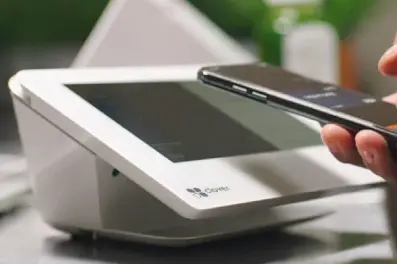 Mobile wallet being used to make a purchase in-store