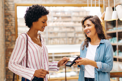 Woman using a credit card to make a purchase