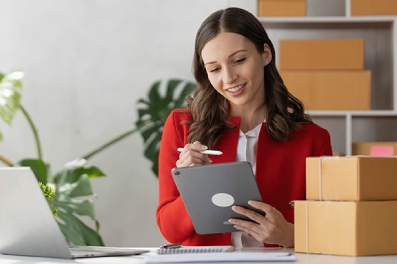 Business owner researching SBA loans on her tablet